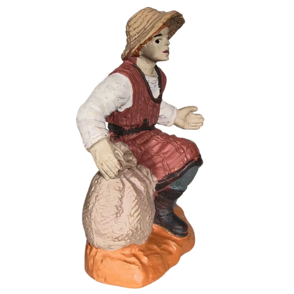 Contadino inginocchiato Oliver 8 cm con sacco