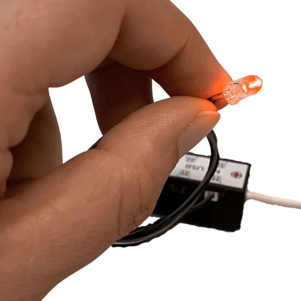 Single orange LED for micro lighting system