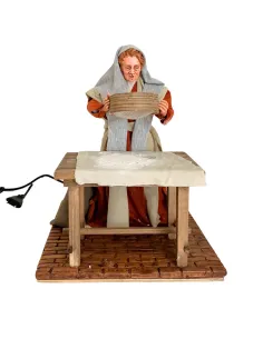 Donna che setaccia la farina palestinese 30 cm in movimento 2