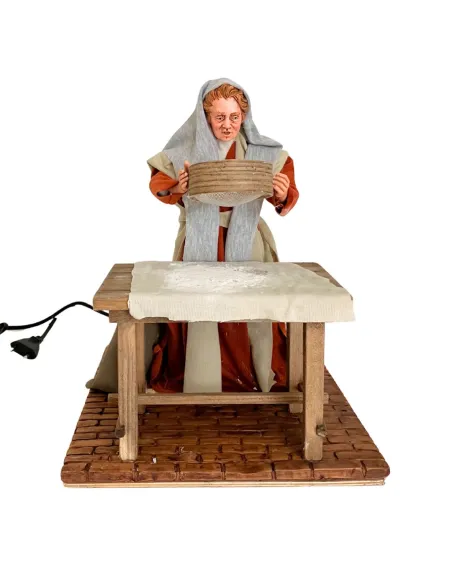 Donna che setaccia la farina palestinese 30 cm in movimento