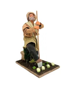 Contadino con vanga in terracotta in movimento 25 cm