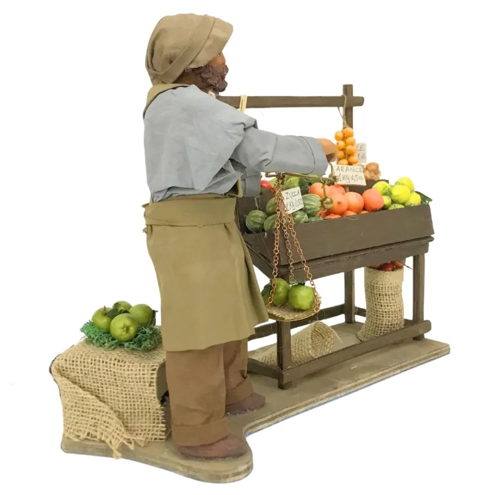 Fruttivendolo con banco e bilancia in terracotta in movimento 25 cm