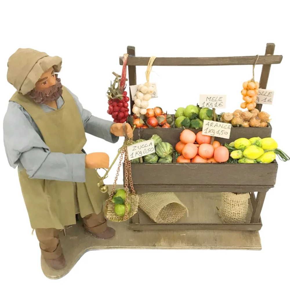 Fruttivendolo con banco e bilancia in terracotta in movimento 25 cm