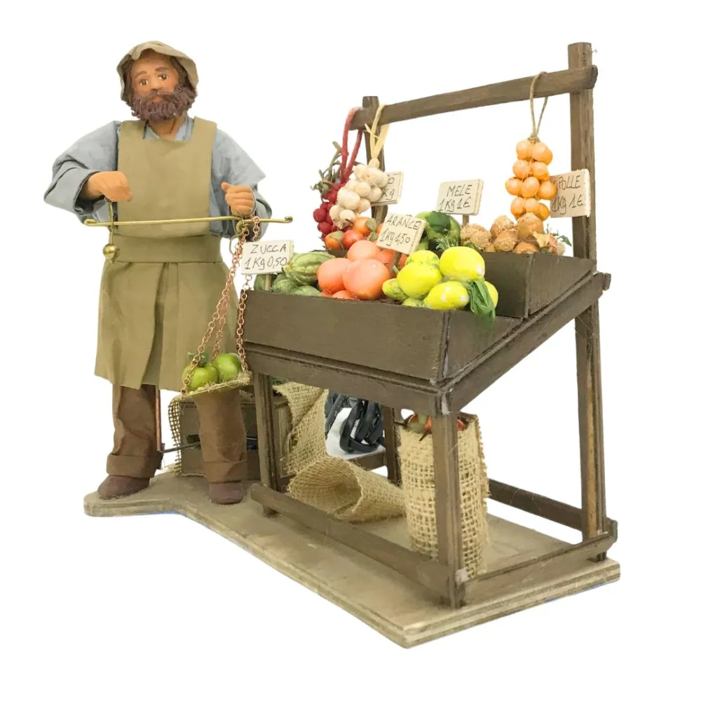 Fruttivendolo con banco e bilancia in terracotta in movimento 25 cm