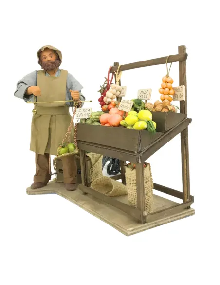 Fruttivendolo con banco e bilancia in terracotta in movimento 25 cm
