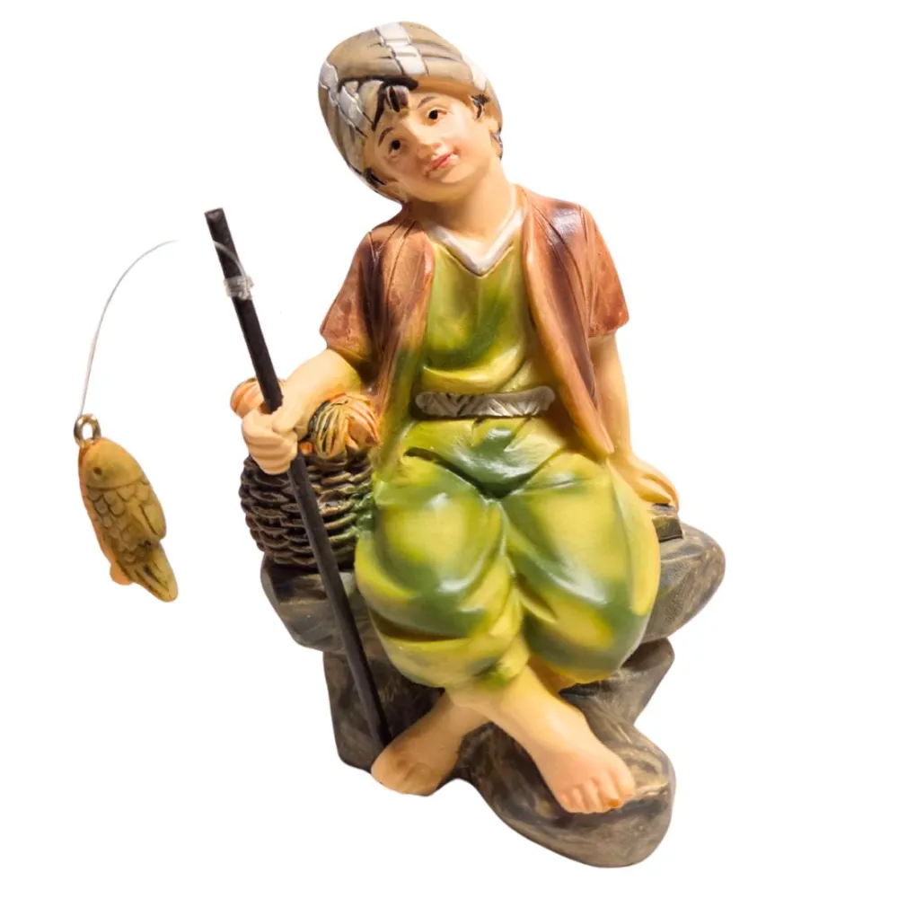Giovane pescatore seduto serie 10 cm