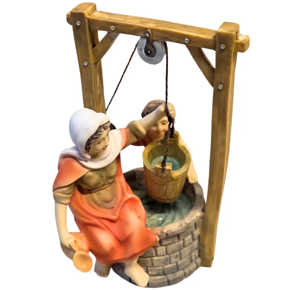 Scena donna al pozzo seduta con bambino serie 10 cm