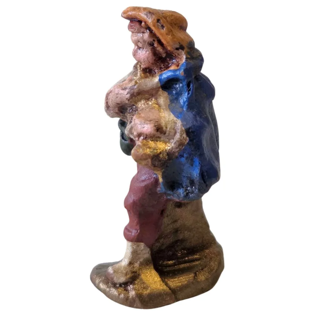 Terracotta flute player – 3 cm