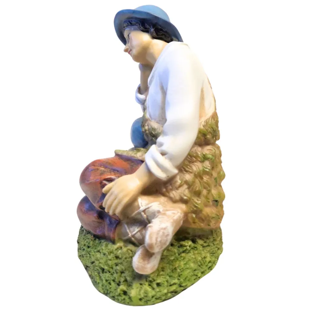 Resin resting shepherd – 30 cm