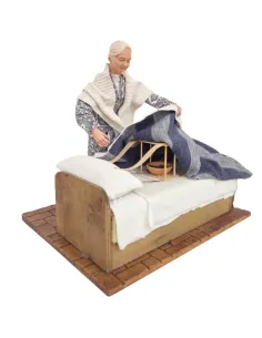 Animated Elderly Woman Warming a Heated Bed - 30 cm