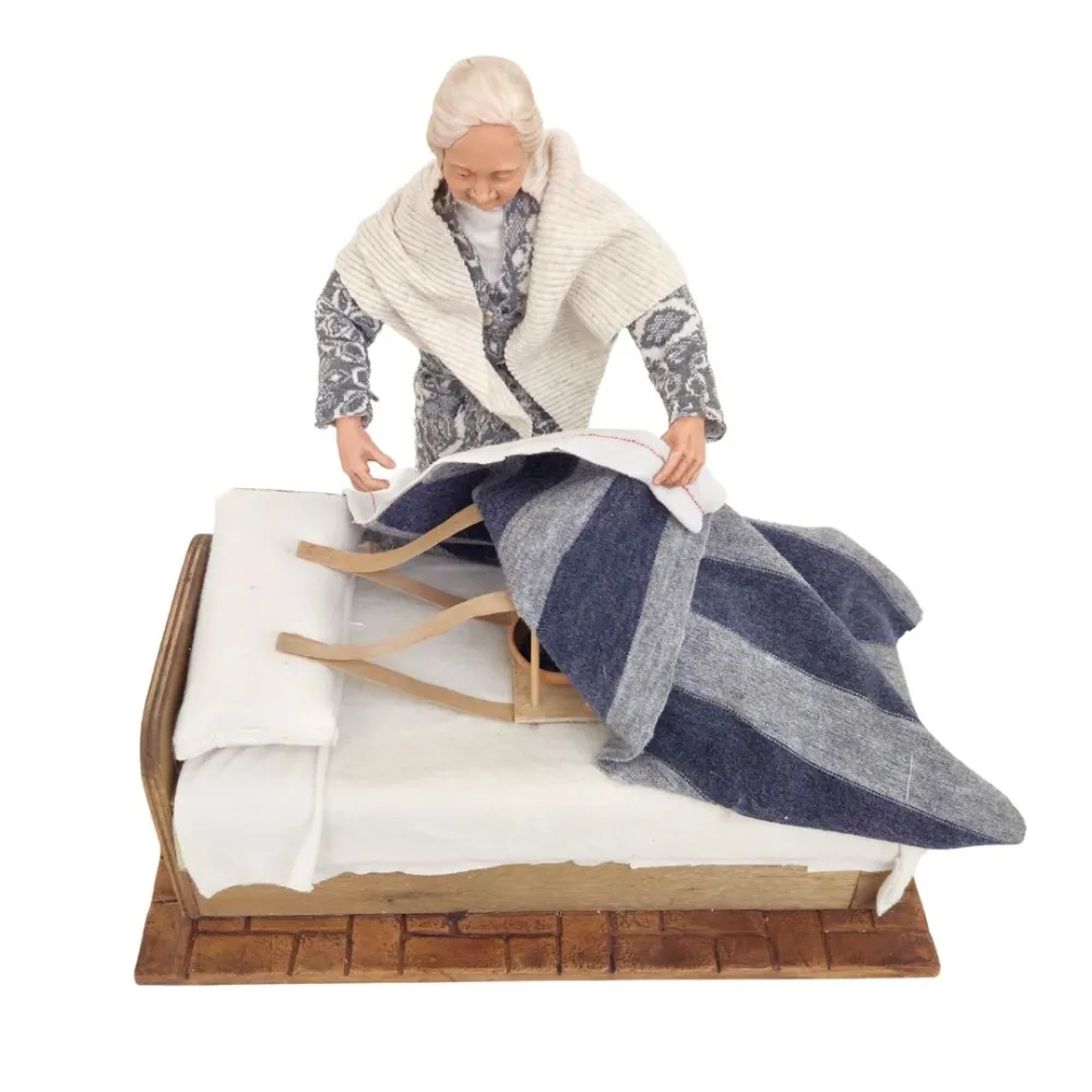 Animated Elderly Woman Warming a Heated Bed - 30 cm