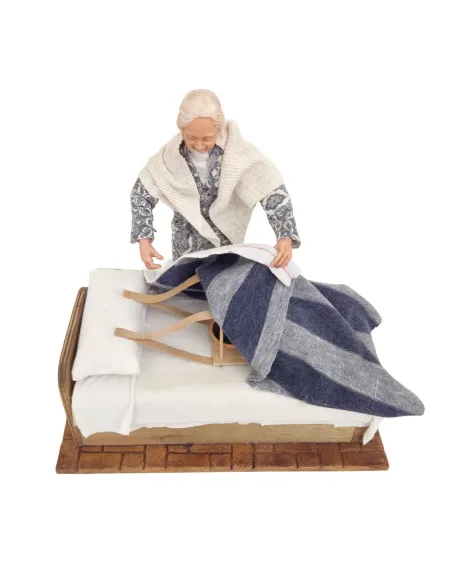 Animated Elderly Woman Warming a Heated Bed - 30 cm