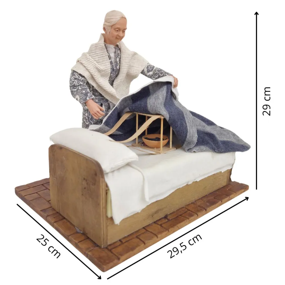 Animated Elderly Woman Warming a Heated Bed - 30 cm