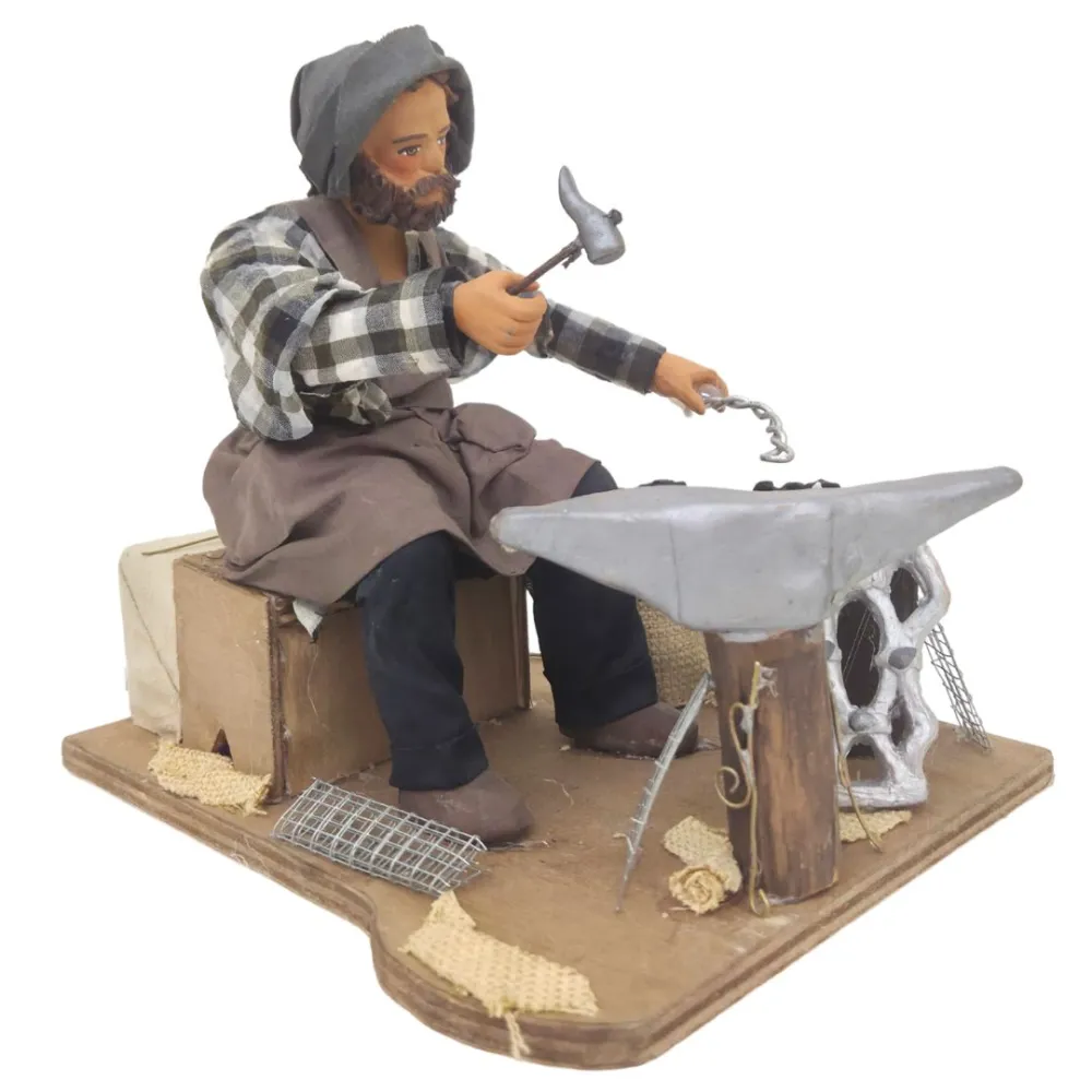 Animated Terracotta Seated Blacksmith with Fire Effect Light - 25 cm