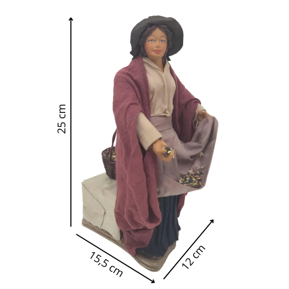 Donna che sparge il mangime in terracotta in movimento 25 cm