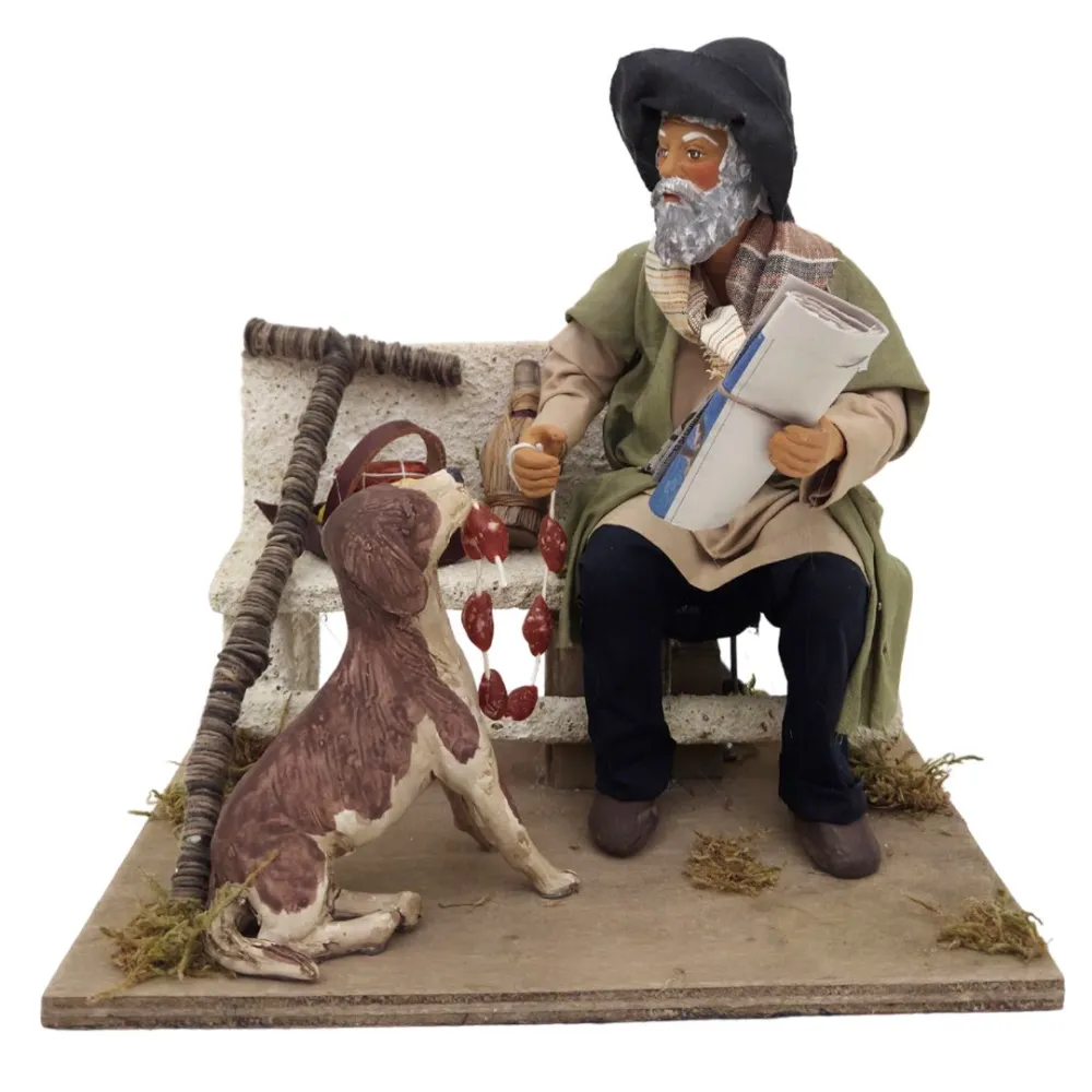 Vagabondo con cane su panchina in terracotta in movimento 25 cm