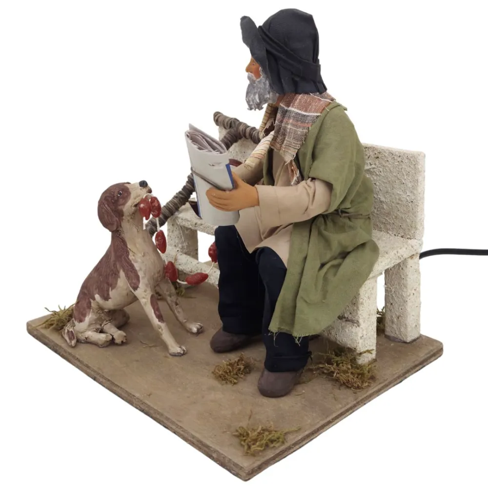 Vagabondo con cane su panchina in terracotta in movimento 25 cm