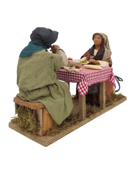 Tavolata con 2 personaggi in terracotta in movimento 25 cm