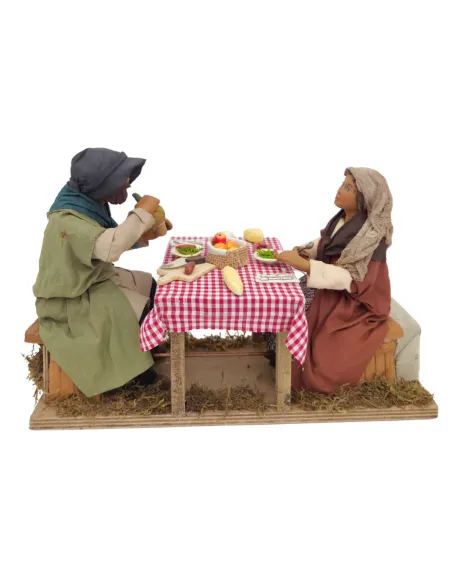 Tavolata con 2 personaggi in terracotta in movimento 25 cm