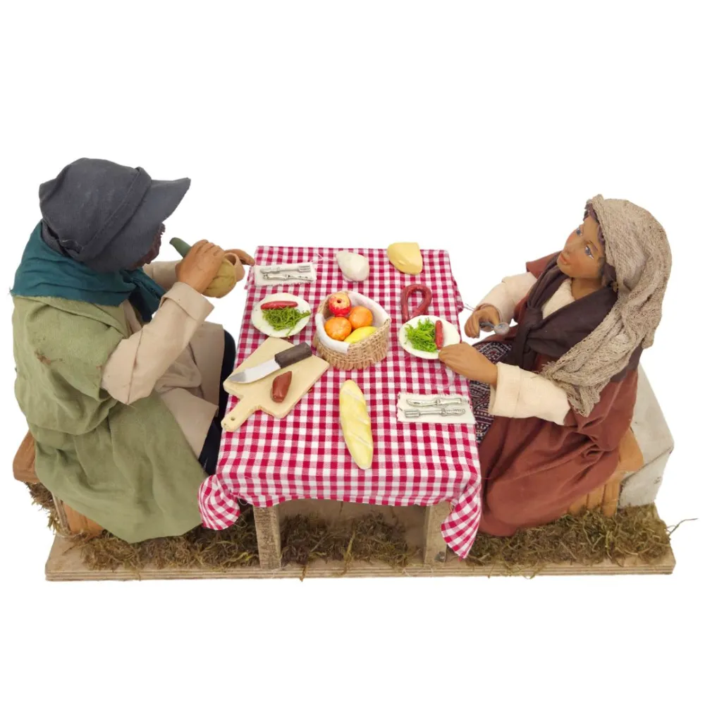 Tavolata con 2 personaggi in terracotta in movimento 25 cm