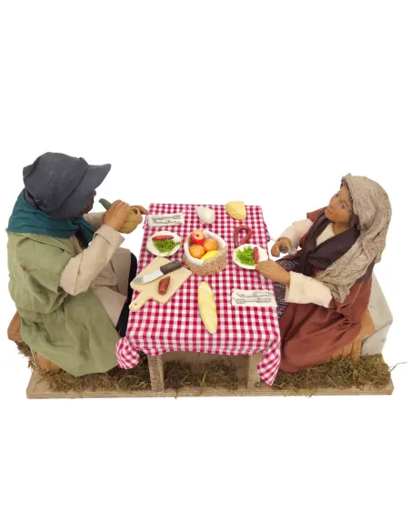 Tavolata con 2 personaggi in terracotta in movimento 25 cm